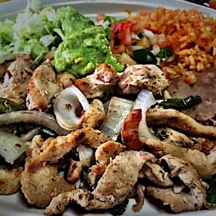 $7.25 Chicken Fajita plate. Chicken was a little dry but okay, and the guac scoop &amp; flour tortillas made up for it.