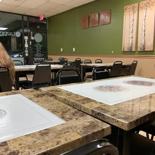 a restaurant with tables and chairs