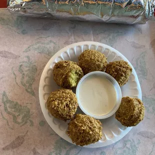 A wrap and six falafel with tahini
