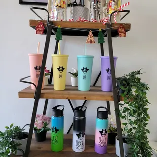 a shelf of colorful cups