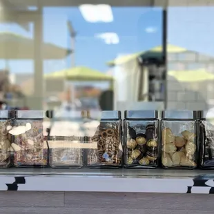 a row of jars filled with food