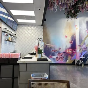a restaurant with a large mural