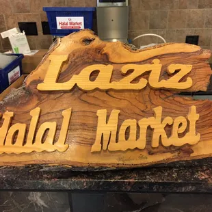 a sign for laziz&apos;s halal market
