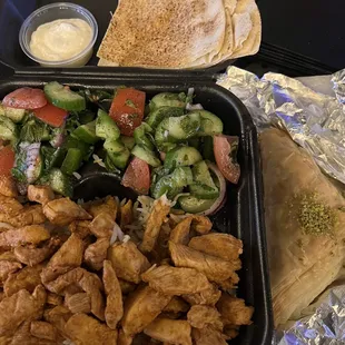 Chicken Shawarma plate with 2 sides of Fattoush, Toum (garlic sauce), pita, and the best Baklava on earth!!!