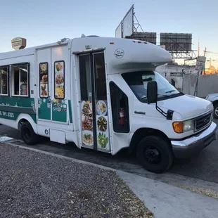 a food truck parked on the side of the road