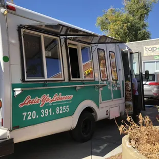 a green and white food truck