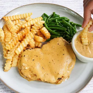 Classics reimagined. 
Voodoo Chicken: Chicken breast blackened with Cajun spices, topped with a three-cheese sauce.