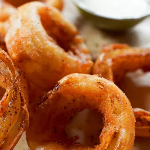 Crispy Beer Battered Onion Rings -- big enough to make a meal out of them. Served best with sides of Creamy Garlic and Honey Mustard.