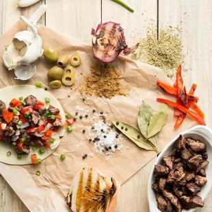 a variety of ingredients on a wooden table