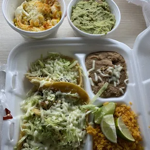 Taco Dinner (carnitas), Mexican corn in top left corner, guacamole in top right corner.