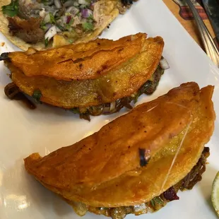 Carnitas taco and Birria Taco, get the consome!