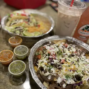 Carne Asada fries, taco plate(shrimp, pork and chicken) and horchata.