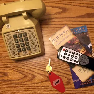 Lazy 8 kickin' it old school with push button phone and an actual key.