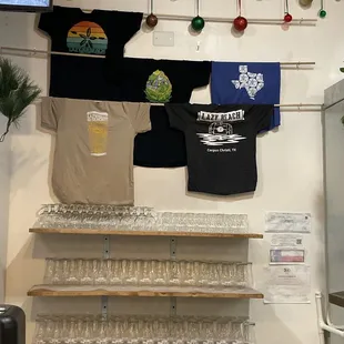 t - shirts hanging on the wall