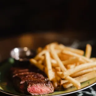 a steak and fries on a plate