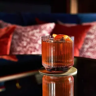 a glass of alcohol on a table