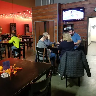 a group of people sitting around a table