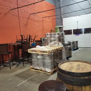 barrels and tables in a warehouse