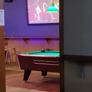 another room with a pool table