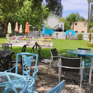 tables and chairs in a backyard