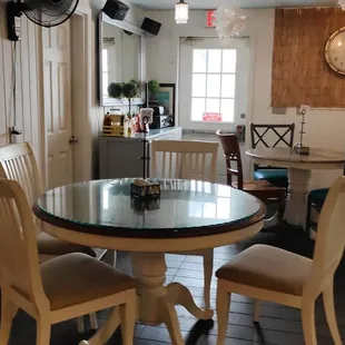a dinning room with a table and chairs