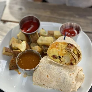 a breakfast burrito and fries