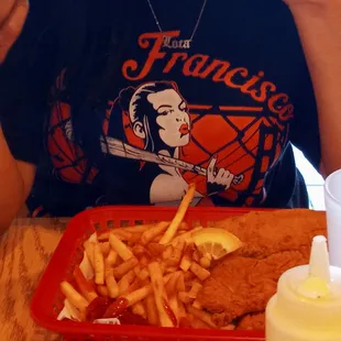 Fried chicken, fish, and fries combo.