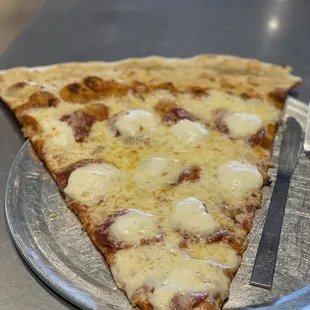 a slice of pizza on a plate