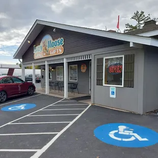 a parking lot with a red car