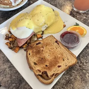 Egg Beni over a Kalevala potato hash with two mini rice pancakes. Rice and cranberry toast.