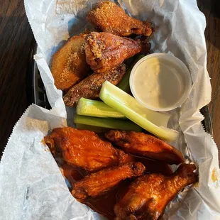 a basket of wings and a pickle