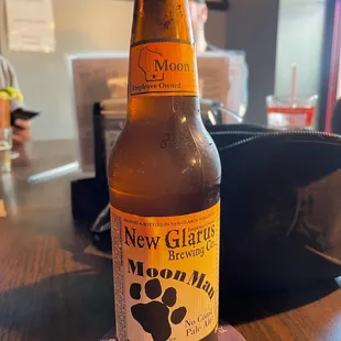 a bottle of beer on a coaster
