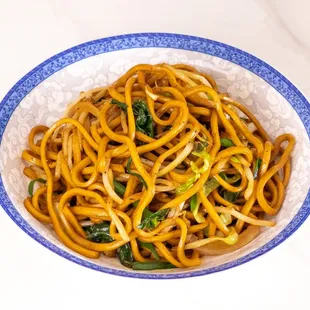 a bowl of noodles with broccoli