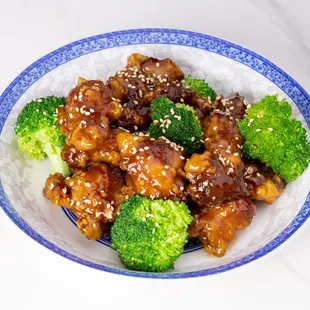 a bowl of chicken and broccoli