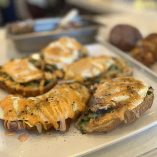 a plate of sandwiches and pastries