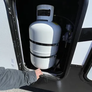Service department bent up the frames when putting in the propane tanks can't even lock Both compartment doors to 2 propane tanks