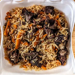 Pilaf with rice, beef, carrots and other instruments of deliciousness.