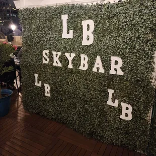 a green wall with letters on it