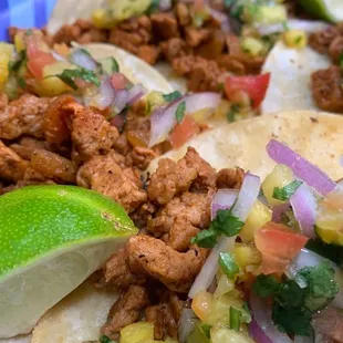 a taco with meat and vegetables