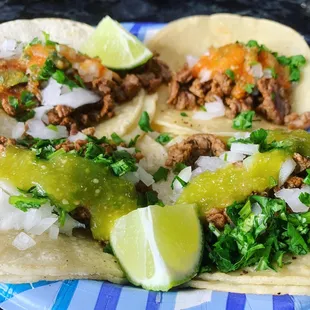 a close up of a plate of tacos