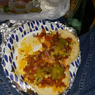 Al pastor tacos with the pineapple habanero and mild tomatillo salsas
