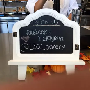 a chalkboard sign for a bakery