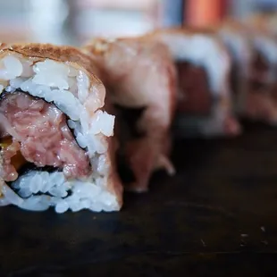 "LBD" - seared wagyu on a wagyu and takuan roll