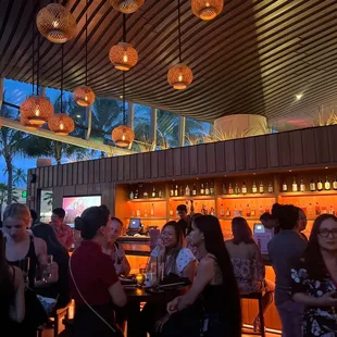 people sitting at the bar