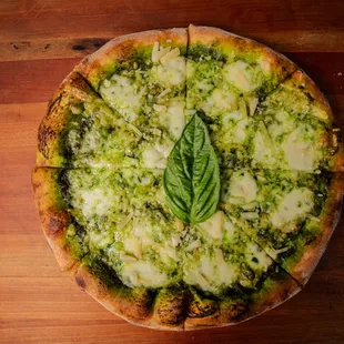 Francesco Pizza
Fresh basil pesto, mozzarella, grated parmigiano.