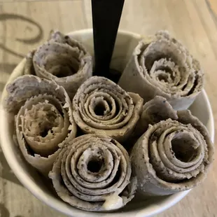 a bowl of rolled up rolls