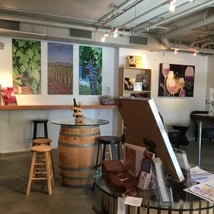 a wine tasting room with wine barrels