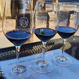 three glasses of wine on a table