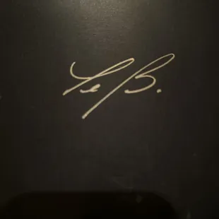 the signature of a man in a suit