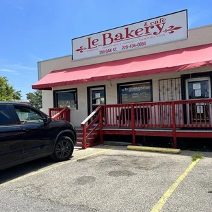 a car parked in front of the restaurant